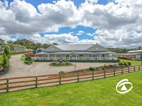 Presented on a fully landscaped 8000m2 allotment (2 Acres) this enviable lifestyle retreat is the result of meticulous planning and an overarching vision of excellence by the owners. Located within the highly regarded Ravendene Estate the property has been finished to the highest standard, with a critical eye to the smallest detail.Arriving at the security coded driveway entry it quickly becomes apparent that this is something special. The residence, a Harkaway Home,will captivate on f Farmhouse Facade, Cabana Decor, Acreage Homes, Built In Wet Bar, Dream Barn Stables, Modern Barn Style, Queenslander House, House Plans Design, Hamptons Style Homes