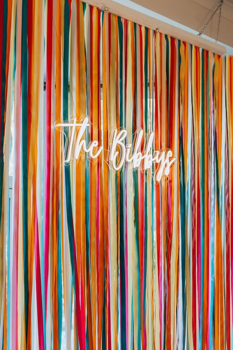 Wedding Backdrop For Photobooth, Neon Sign Backdrop Ideas, Ribbon Wedding Backdrop, Wall Decor For Wedding Reception, Ribbon Wall Backdrop, Creative Wedding Backdrop, Colorful Photo Backdrop, Colourful Wedding Backdrop, Neon Wedding Decor