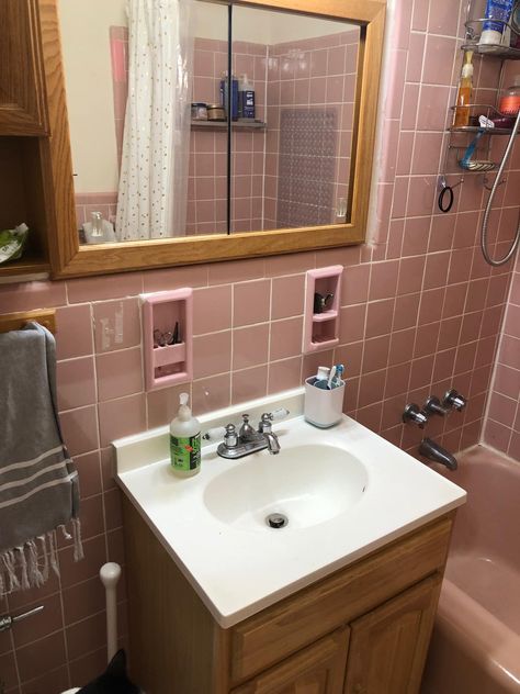 Ask Apartment Therapy: What Should I Do With This Dated Pink Bathroom? | Apartment Therapy Old Pink Bathroom Makeover, Pink Bathroom Tiles Update, Pink Bathroom Rental, Updated Pink Tile Bathroom, Pink Tile Bathroom Makeover, Old Pink Tile Bathroom Ideas, Vintage Pink Bathroom Update, Pink Tile Bathroom Ideas, 70s Pink Bathroom Remodel