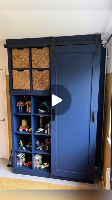 DIY Mum - Kayleigh Sherbourne on Instagram: "🔹GIANT IKEA KALLAX MAKEOVER🔹

We all know I love a KALLAX makeover, so I decided to go big on this one. Using one 4x4 KALLAX and one 2x4 KALLAX I made a wardrobe for my son’s room.

This may look built in but it’s not, it’s renter friendly! The KALLAX units are attached to each other and then both attached to the wall with brackets. 

I painted the wall and the KALLAX units in ‘Hornblower’ from @frenchicpaint #gifted 

I made the door out of 12mm MDF with 9mm MDF for the shaker style panels. I also used 9mm MDF to make it look more built in. 

I bought the barn door kit from @amazonuk the rail is attached to the MDF and the KALLAX unit and I’ve used metal self drilling plasterboard fixings too. My whole body weight has hung off this so trust m Kallax Makeover, Mdf Panelling, Kallax Unit, Drawers Handles, Frenchic Paint, Fitted Wardrobe, Upcycle Furniture, Barn Door Kit, House Work