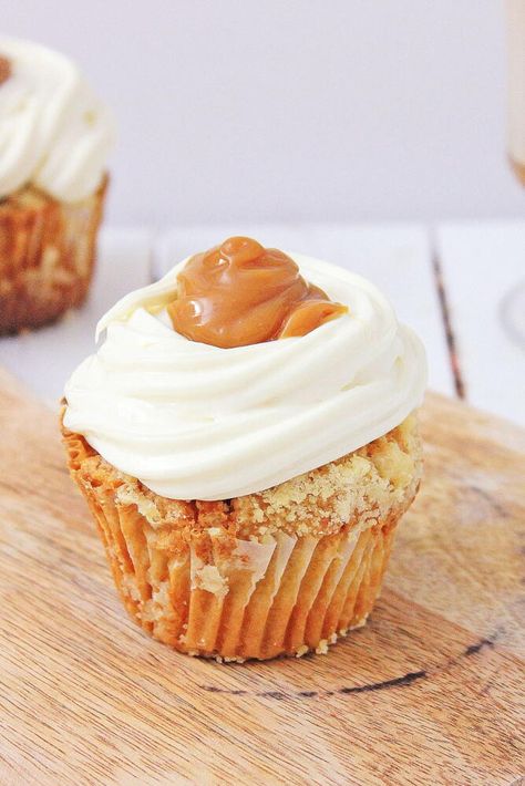 "These Hot Buttered Rum Cupcakes are sure to bring a taste of this classic cocktail to any celebration. Tender cupcakes topped with sweet rum frosting, and a buttery caramel sauce give these amazing cupcakes their sweet taste. These cupcakes are a great way to give your holiday baking an extra special touch. Plus, the rum frosting is light and fluffy, while the buttery caramel sauce adds a rich flavor that ties everything together. And they are perfect for any occasion, these Hot Buttered Rum Rum Frosting, Rum Cupcakes, Amazing Cupcakes, Cauldron Cake, Boozy Cupcakes, Moist Cupcakes, Buttered Rum, Winter Cooking, Hot Buttered Rum