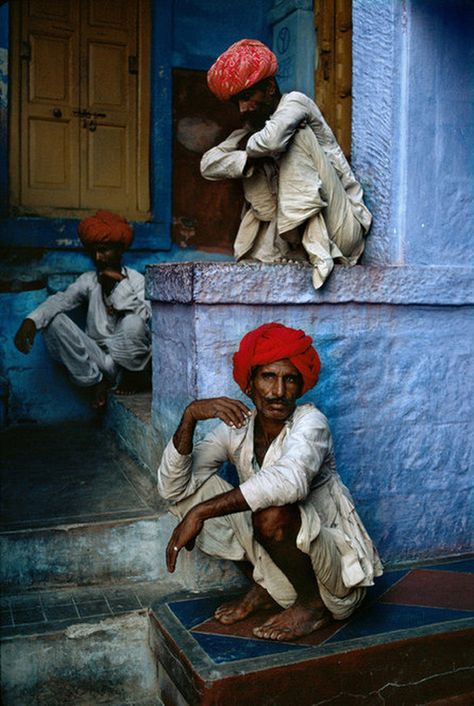 Three men sit in the old quarter in Jodhpur, India, 1996 by Steve McCurry Steve Mccurry Photos, Photos Black And White, Steve Mc, Steve Mccurry, India Photography, 사진 촬영 포즈, Blue City, We Are The World, Magnum Photos