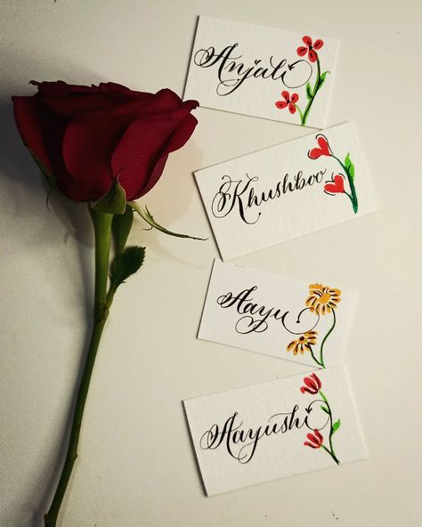 Name cards in Calligraphy ✨ Attach it with rose of any flower and give it to your loved ones . Theh will feel really special ✨ Try it 😉😉 Dm to make this for yours If you find name of yours . Do comment with ❣️ #photooftheday #photographylovers #photographyclub #namecards #calligraphyplacecards #calligraphynamecard #lettering #flourishing #letteringcommunity #instagrambusiness #smallbusinesssupport #localforvocal #artist_features #artoftheday #artmuseum #artbliss #artgallery #artistwork #... Diy Calligraphy, Find Name, Rose Aesthetic, Colorful Borders Design, Walnut Ink, Calligraphy Cards, Copperplate Calligraphy, Calligraphy Words, Tag Ideas