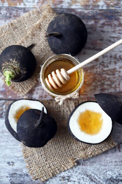 Black radish with honey on a wooden tabl... | Premium Photo #Freepik #photo #food-wood #radish #honey #healthy-food Black Radish, Photo Food, Black Food, Wooden Table, Everyday Food, Wooden Tables, Premium Photo, Healthy Food, Honey