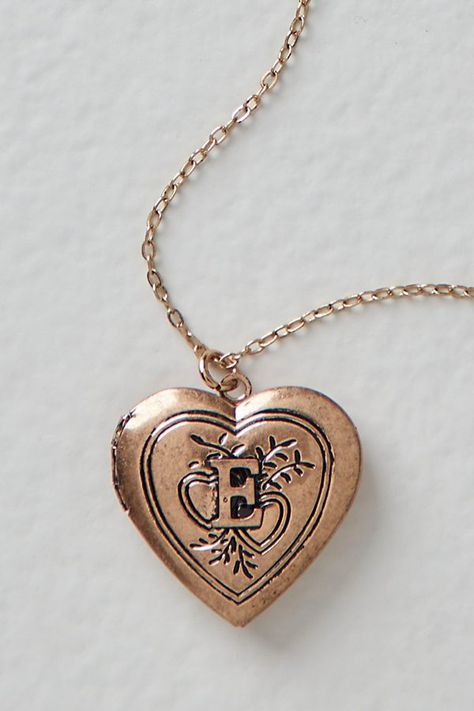 A super sweet gift or an accessory unique to you, this darling monogram necklace features a heart locket pendant with an initial engraving. **Features:** Dainty chain, heart locket pendant, hinge opening mechanism, monogram initial engraving, clasp closure **Why We | Monogram Necklace by Free People in Gold Free People Necklace, Ella Enchanted, Engraved Locket, Chain Heart, Gold Locket, Dainty Chain, Monogram Necklace, Classy Jewelry, Jewelry Lookbook