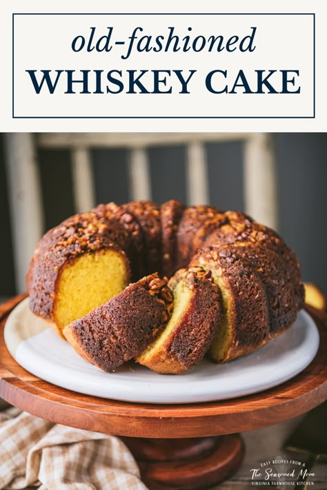 A perfect celebratory dessert for the holidays! This easy whiskey cake recipe starts with a box of cake mix for a moist, flavorful, and quick yellow Bundt cake that's topped with walnuts and soaked with a rich, butter-whiskey glaze. The old-fashioned treat has been a favorite for generations! Whisky Cake Recipe, Whiskey Cake Recipe, Alcohol Cakes, Whisky Cake, Boozy Cakes, Boozy Baking, Bourbon Cake, Whiskey Glaze, Liquor Cake