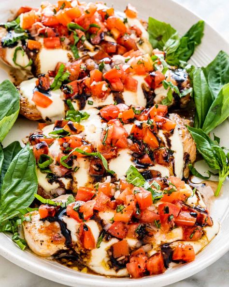 My recipe for Bruschetta Chicken is made with melty mozzarella cheese, then topped with the easiest fresh bruschetta. All that with just a few kitchen staple ingredients? You'll be welcoming this main event to your weekly rotation. #bruschetta #chicken #recipe Livy Losers, Bruschetta Chicken Bake, Chicken Bruschetta, Chicken Bruschetta Recipe, Homemade Bruschetta, Jo Cooks, Grilled Bruschetta, Bruschetta Chicken, Bruschetta Recipe