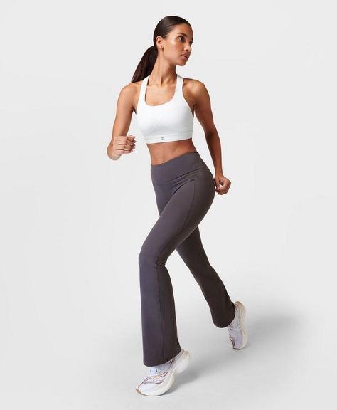 A sleek update on our flared trousers in our bestselling Power fabric. Sweat-wicking and quick-drying with 4-way stretch. Bum-sculpting seams and a flattering new bootcut silhouette. Features an adjustable internal drawcord at the waist. Two side slip pockets and zip pocket at the back of the waistband. Inseam length: 76cm / 30". Model wears size S and is 178cm/5'10" tall. Style Code: SB9218SColour: Urban Grey Grey, Trousers, Yoga, Gym, Flared Trousers, Women's Trousers, Sweaty Betty, Trousers Women, Yoga Pants