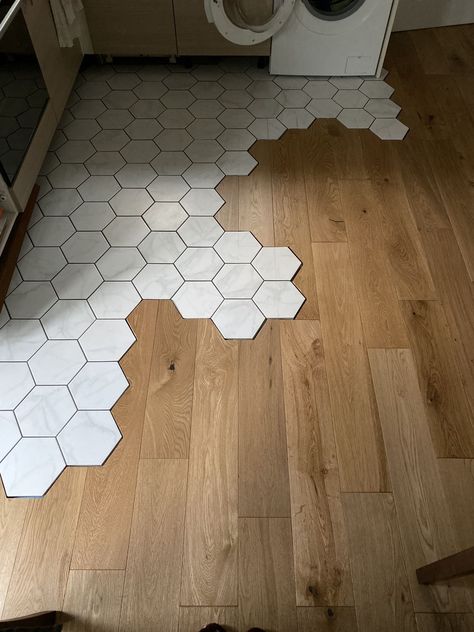 Transition from hexagon tiles to wood floors Hexagon And Wood Floor, Hex Tile To Wood Transition, Hexagon To Wood Transition, Hexagon Transition Flooring, Hexagon Tile Wood Transition, Hexagonal Tile Kitchen, Hexagon Tiles To Wood Floor Transition, Octagon Tile Into Wood Floor, Hexagon Tile And Wood Floor