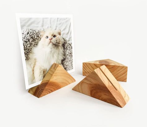 PRICES MAY VARY. 【Stunning triangle photo holder】This wood card holder is the perfect accessory for desk, dresser or shelves,it can hold small art prints and photos of various sizes and shapes,use it to rotate your favourite pictures or hold gift cards, menus and table numbers! Paired with family photos, this card holder will become a thoughtful gift. 【Handcrafted from solid eco-friendly wood】The groove is wide enough to accommodate different kinds of paper and photo sizes (up to 5x7),We are usi Wood Card Holder, Office Stationary, Wooden Display Stand, Wood Scraps, Small Woodworking Projects, Wood Card, Wooden Display, Scrap Wood Projects, Small Art Prints