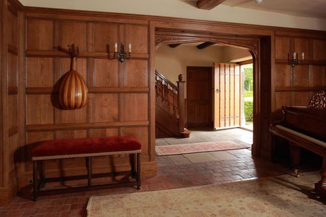 Oak paneled entrance hall with Tudor arched opening, by Stuart Interiors.  *** Love the paneling, the Tudor arch and the floral carvings around the arch. Oak Panelling, Custom Interior Doors, Wooden Panelling, Townhouse Interior, Wooden Wall Panels, Oak Panels, Oak Doors, Entry Way, Staircases