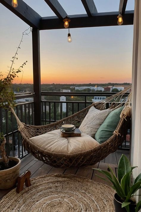 Discover how to turn your small apartment balcony into a cozy reading nook with comfortable seating, soft cushions, and ambient lighting. Perfect for book lovers! Comfy Balcony Furniture, Cozy Balcony Seating, Cozy Outdoor Balcony, Vibey Apartment Balcony, Hammock Balcony Apartment, Small Seating Area Ideas, Balcony Reading Nook, Cozy Balcony Ideas Apartments, Tuber Rose