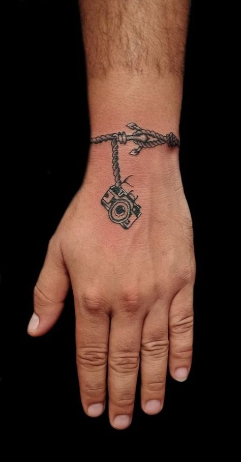 Unique Men’s Wrist Tattoos: Ideas for Personal Style and Expression Mens Bracelet Tattoo For Men, Wrist To Hand Tattoo Men, Wrist Hand Tattoo Men, Small Tattoos For Men On Wrist, Men’s Wrist Tattoo Ideas, Men Bracelet Tattoo, Hand And Wrist Tattoos For Guys, Wrist Tattoo For Men Unique, Wrist Bracelet Tattoo For Men