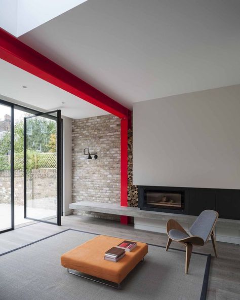 A Hans Wegner Shell chair by Carl Hansen & Søn outfits the living room, which is defined by a steel beam painted sharp red Interior Design Minimalist, Bedroom Minimalist, Interior House Colors, Steel Beams, Casa Container, London House, House Extensions, Traditional Interior, Decor Minimalist