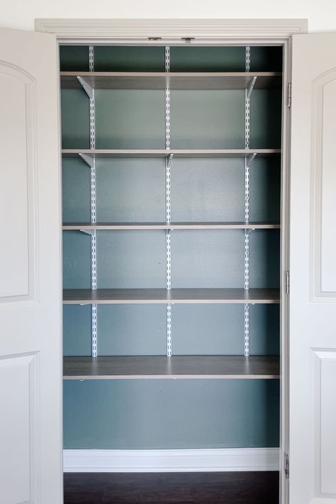 Want to replace wire pantry shelves? I swapped ours for affordable track shelving! This is an easy DIY project that made a big difference. | how to remove and replace wire pantry shelves on a budget, affordable pantry shelves, upright track shelving Adjustable Pantry Shelving Ideas, Ikea Pantry Ideas, Adjustable Closet Shelving, Track Shelving, Diy Pantry Shelves, Painting Ikea Furniture, Pantry Inspiration, Elfa Shelving, Grey Shelves