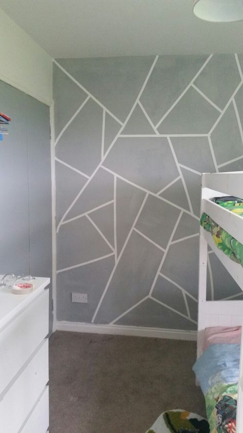 Masking tape feature wall in my boys bedroom Masking Tape Accent Wall, Abstract Tape Painting Accent Walls, Painter Tape Designs Wall, Masking Tape Painting Walls Bedroom, Drawing Room Feature Wall, Masking Tape Wall Design, Triangle Wall Paint Bedrooms, Taped Wall Designs Painters, Masking Tape Wall Paint