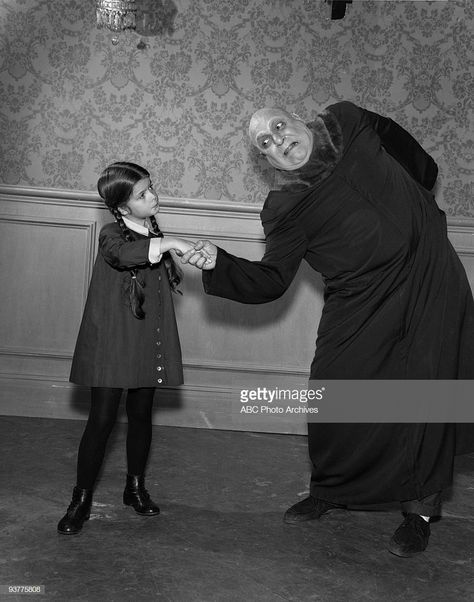 The Addams Family 'Fester Goes on a Diet' Season One, Uncle Fester ( Jackie Coogan) shakes Wednesday's (Lisa Loring) hand., Lisa Loring, Fester Addams, Original Addams Family, Addams Family Series, The Girl From Uncle, The Addams Family 1964, Addams Family Characters, Addams Family Tv Show, Pugsley Addams