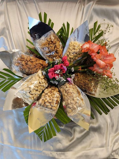 Witness the artistry of nature and taste combined in our captivating Dry Fruit Flower Gift Tray, where meticulously packed dry fruit packets form a stunning bloom, elegantly adorned with lush greens. Mapp Academy students have created this exquisite masterpiece, weaving healthful indulgence with natural beauty. The flower-shaped arrangement, crafted from diverse dry fruit packets, presents a unique visual delight.#DryFruitFlowerTray #NutritiousIndulgence #MappAcademyCraftsmanship Dry Fruits Packing Ideas Gift In Jars, Dry Fruit Tray Decoration Ideas, Dry Fruit Packing Ideas, Dry Fruits Packing Ideas Gift In Tray, Dryfruits Packing Ideas, Dry Fruits Packing Ideas, Dry Fruit Hamper, Dry Fruits Packing Ideas Gift, Dry Fruits Packing