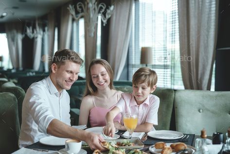 Happy family in a restaurant by AboutImages. Happy family with a child dining in a restaurant#restaurant, #family, #Happy, #dining Family At Restaurant Photography, Family Restaurant Photography, Hotel Breakfast Buffet, Sustained Investigation, Where To Live, Hotel Ads, Restaurant Ad, Diy Background, Pacific Place