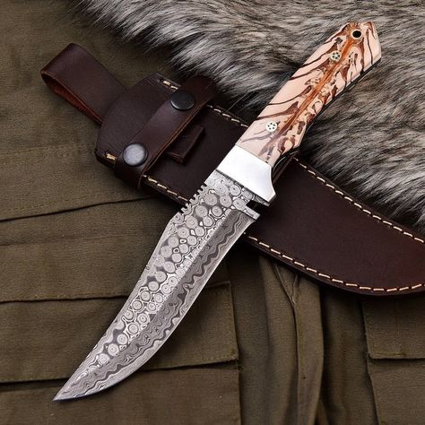 CUSTOM HANDMADE DAMASCUS STEEL HUNTING KNIFE WITH PINE CONEHANDLE MEASUREMENTS:- OVERALL LENGTH = 11 NCHES APPROX BLADE LENGTH = 6 INCHES APPROX DAMASCUS PATTERN = Rain drop BLADE MATERIAL = DAMASCUS STEEL OIL TEMPERED TO 56-58 HRC DM or Contact Below Details for Further Information: info@elegant-blades.com Whats Ap:+447466553242 #handmade #handcraft #viral #trending #explore #hunting #camping Pretty Knives, Damascus Blade, Damascus Steel Knife, Damascus Knife, Hunting Knife, Rain Drops, Damascus Steel, Damascus, 6 Inches