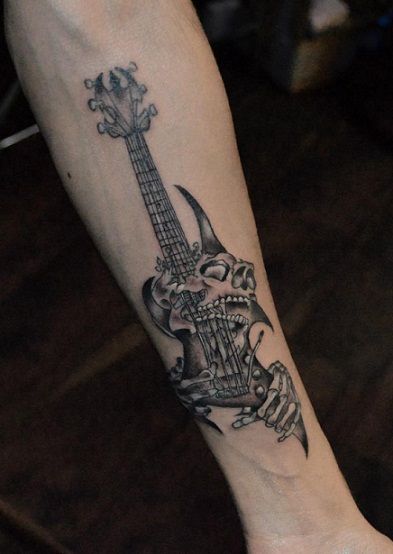 skull with guitar tattoo done by jassi tattoos, Guitar Back Tattoo, Guitar Tattoo Aesthetic, Guitar Inspired Tattoos, Fretboard Tattoo, Rock Guitar Tattoo, Metal Tatoos Ideas, Electric Guitar Tattoos, Guitar Hero Tattoo, Rock Inspired Tattoos