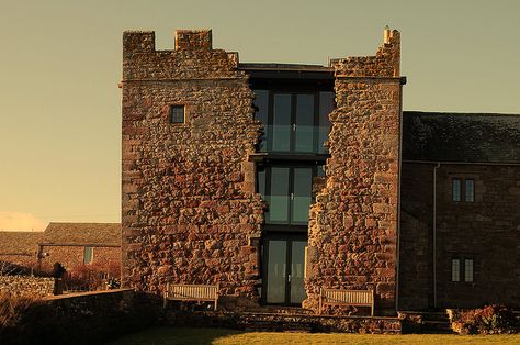 Blencowe Hall, located in Cumbria, England. A 14th century manor whose towers were left to decay for over 300 years. The large gash in the masonry wall of the south tower is believed to be the result of an attack during the English Civil War. Renovation Architecture, Masonry Wall, Baroque Architecture, Architecture Old, Stone House, Cumbria, 14th Century, Facades, Amazing Architecture