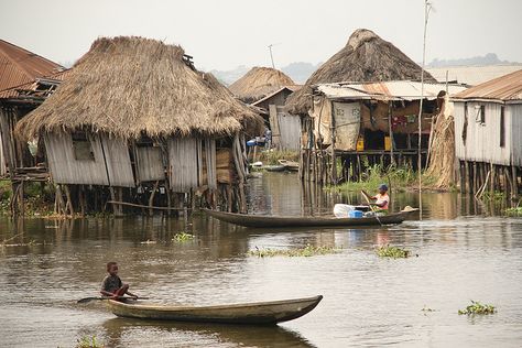 Benin - Boats crossing before the houses of Ganvie, a floating village in Lake Nokoue Raised Architecture, Dystopian Slums, Floating Village, Body Painting Festival, Shanty Town, Village Photos, Water House, Village Photography, European Paintings