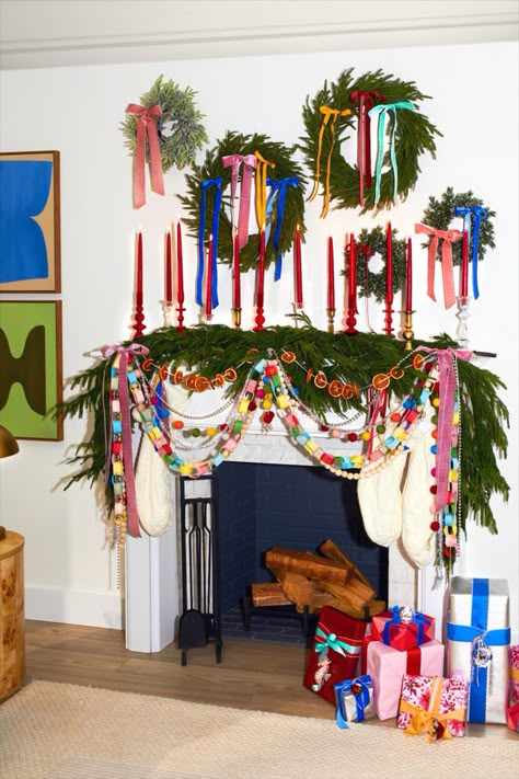 One of our favorite holiday decor ideas is to create a wreath gallery wall. It's a budget-friendly way to decorate above your mantel or fireplace since smaller wreaths are usually cheaper than large oversized ones. Adding cute color bows really completes the maximalist look! #maximalistchristmasmantel #maximalistholiday #whimsicalholiday #bhg Kitsch Christmas, Holiday Mantel, Cindy Lou Who, Vibrant Decor, Instagram London, Holiday Decor Ideas, Christmas Decor Inspiration, Cindy Lou, Décor Boho