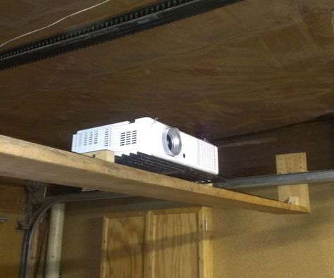 Adjustable under garagedoor shelf/projector mount Homemade Projector, Country Beach House, Projector Shelf, Hangout Area, Open Garage, Transformation Church, New Home Diy, Tiki Oasis, Projector Mount