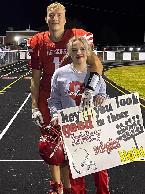 Football sign reading “hey number one, you look good in those Friday night Lights” Football And Cheer Hoco Proposal, Hoco Posters For Cheerleaders, First Football Game Poster Ideas, Football Game Hoco Proposals, Signs For Football Games Boyfriend, Football And Cheerleader Hoco Proposal, First Football Game Gift For Boyfriend, Football Signs For Games Posters For Bf, Football Posters High School Ideas Boyfriend