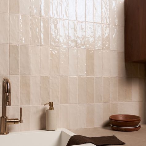 Shop Portmore Sand 3x8 Glazed Ceramic Tile. Ceramic with a handmade look Refresh any space with our Portmore Sand 3x8 Glazed Ceramic Tile, a versatile, classic subway in a go-to neutral shade that suits any design style. Portmore’s appearance—speckled, uneven, and artisanal—lends it a rustic, yet sophisticated vibe. With its subtle, Moroccan influence, this glazed tile will transform your residential or commercial walls with long-lasting, statement-making beauty. Moroccan-inspired, made in Spain Colored Subway Tile Kitchen, Blush Tile Bathroom, Boho Tile Bathroom, Cream Tile Bathroom, Cream Bathroom Tiles, Beige Shower Tile, Steam Bathroom, Zellige Tile Bathroom, Rustic Pub