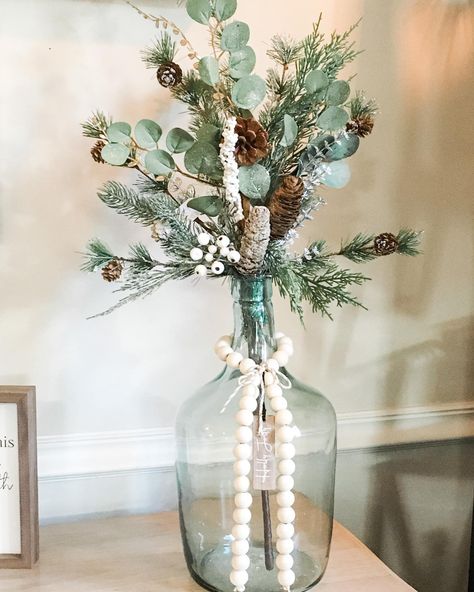 Eucalyptus Christmas Decor Vase, Christmas Greens In Vase, Christmas Jug Decoration, Green And Grey Christmas Decor, Sage And White Christmas Decor, Green And Wood Christmas Decor, Christmas White And Green, Christmas Glass Vase Decor, Sage Green And White Christmas Decor