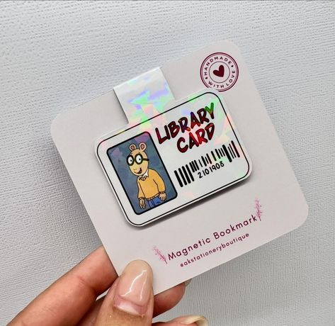 Having fun isn’t hard - when you’ve got a Library Card 🎶 Never lose your place again with these Arthur Library Card Magnetic Bookmarks. With the use of 2 magnets these clip over your page and stay right where you left them. These are not only for reading books, but great for keeping your place in notebooks, filing systems, journals, and more… Having a themed party? These make for a great party favours or just an addition to a gift. 💌DM to Order or Shop these on my Etsy Shop (link in bio)... Bookmark Ideas Creative, Arthur Library Card, Markers Drawing Architecture, Sticker Business, Creative Bookmarks, Bookmark Craft, Small Business Packaging, Magnetic Bookmarks, Book Markers