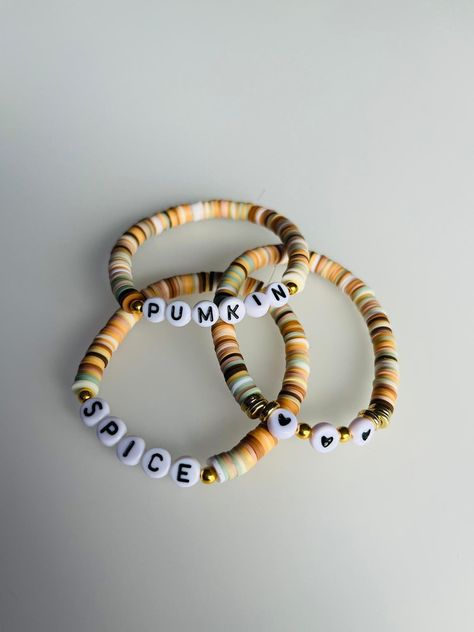 Polymer Clay Bracelet Ideas Fall, Pumpkin Bead Bracelet, Clay Bead Bracelet Ideas Autumn, Preppy Halloween Clay Bead Bracelets, Country Clay Bead Bracelets, Hocus Pocus Clay Bead Bracelet, Clay Bead Halloween Bracelet Ideas, Clay Bead Fall Bracelets, Cute Fall Clay Bead Bracelets