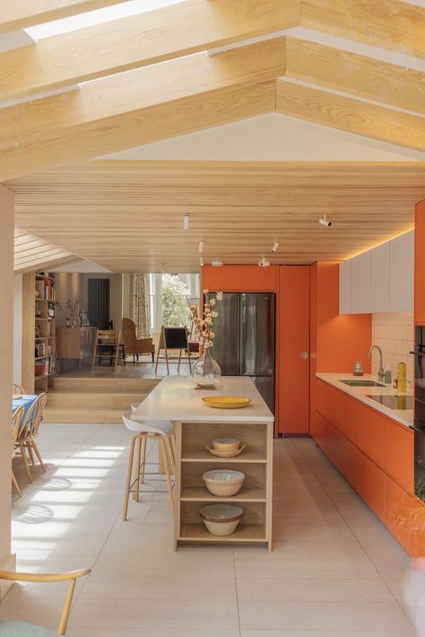 A playful family kitchen featuring Formica Clementine, Arpa Bloom Bianco Nube and oak veneered birch plywood kitchen fronts with J-profile handles, customising IKEA Metod or Sektion kitchen units, in this London side return extension.  An oak veneered plywood Urtil shelving unit adds a custom hand-built feel to the island.  #plywoodkitchen #birchplywood #plywood #ikeahack #kitchenideas #kitchentrends #japandikitchen #kitchenextension  Architect: A Small Studio Photographer: Manuel Vazquez Rear Kitchen Extension, Oak Shelving Unit, Japandi Kitchen, Plywood Kitchen, Ikea Kitchen Cabinets, Wall Units, Bench Seating, Shelving Units, Kitchen Extension