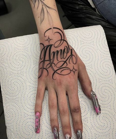 Malachi Tattoo Name, Mexican Font Tattoo, Name On Hand Tattoos For Women, Raiders Tattoos For Women, Finger Name Tattoos For Women, Hand Tattoo Name, Name Hand Tattoos, Name Tattoo Placement For Women, Hand Name Tattoos