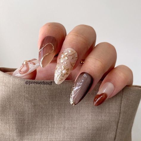 ✨ Gold Floral Nail Set ✨ "Chairo" 💫 Origin: Japanese 💫 Meaning: "brown" *Medium almond shape is displayed in the photos*   All sets are made to order and I will make sure orders are shipped out as soon as possible. Although, I am one person and all nail sets are designed and made by me, so I do apologize if there are any delays or slow processing on my end. Every nail set is carefully hand painted and thoughtfully hand designed. While I only use high quality materials, I make sure every nail s Hombre Brown Nails, Fall Nails Mix And Match, Clear Brown Nails, Fall Douyin Nails, Brown Cat Eye Nails Design, Transitional Nails, Gold Accent Nail Design, 3d Fall Nails, Brown Celestial Nails