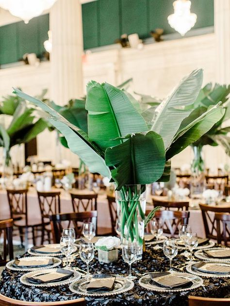 a modern centerpiece with large banana leaves and a clear vase DIY them all Filipiniana Wedding Theme, Tropical Wedding Centerpieces, Filipiniana Wedding, Tropical Centerpieces, Greenery Wedding Centerpieces, Hollywood Glam Wedding, Filipino Wedding, Tropical Glam, Tropical Twist