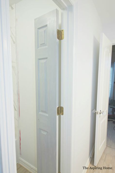 DIY Petite Double Doors From Bifold Doors | The Aspiring Home Sliding Double Doors Interior Small Spaces, Bifold Accordion Doors, Paint Bifold Doors, Bathroom Closet Door Ideas Small Spaces, Bifold Door For Bathroom, Vertical Split Door, Tiny Bathroom Door Ideas, Diy Bathroom Door Ideas, Bifold Door Bathroom