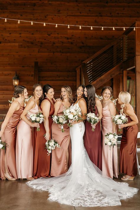 Bride in Lace Wedding Gown with Mismatched Bridesmaids in Shades of Red and Pink | White Floral Wedding Bouquets Burgundy And Peach Bridesmaid Dresses, Mismatch Red Bridesmaid Dresses, Bridesmaid Dresses Red Shades, Fall Pinks Wedding, Pink Shades Bridesmaids, Autumn Bridesmaids Dresses, Mismatched Bridesmaid Dresses Burgundy, Maroon Mismatched Bridesmaid Dresses, Cream And Maroon Wedding