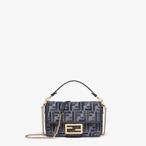 Small iconic Baguette bag made of chenille with the iconic FF motif in dark blue gradient tones, embellished with dark blue calfskin trim and decorated with an FF clasp. Featuring a front flap, magnetic clasp, one gray fabric-lined internal compartment with a calfskin pocket and gold-finish metalware. The bag can be carried by hand, or worn either on the shoulder or cross-body thanks to the calfskin handle and chain shoulder strap, both detachable. Made in Italy Dark Blue Gradient, Fall Fashion Shoes, Fendi Baguette, Blue Gradient, Baguette Bag, Gray Fabric, Boot Bag, Magnetic Clasp, Fendi Bags