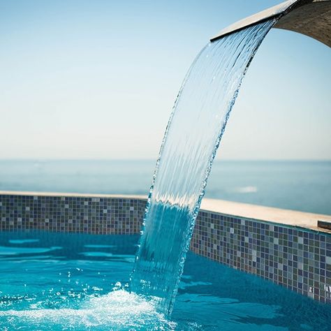 Choosing Waterline Pool Tile | Daltile Blue Pool Tile, Waterline Pool Tile, Hot Tub Designs, Exterior Tiles, Pool Liners, Current Design Trends, Blue Pool, Interior Design Magazine, Natural Pool