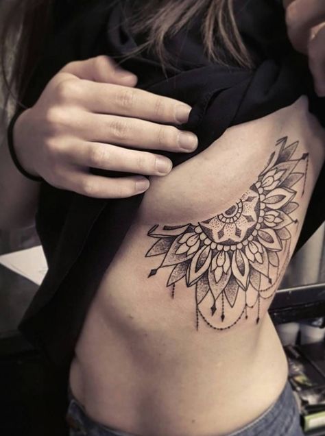 a list with 50 of the most beautiful mandala tattoo designs we've seen and the symbolism behind this sacred & timeless pattern. #chesttattoos #tattoo #tattoos Mandala Chest Tattoo, Underboob Tattoos, Rib Tattoos For Women, Underboob Tattoo, Pieces Tattoo, Muster Tattoos, Chest Tattoos For Women, Chest Piece Tattoos, Stomach Tattoos