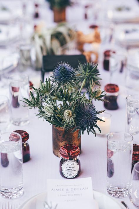 Blue and green thistle wedding centerpieces for the BoxHouse Hotel. Navy And Green Centerpieces, Thistle Floral Arrangement, Scottish Wedding Centerpieces, Thistle Table Decorations, Thistle Centre Pieces Wedding, Scottish Wedding Table Decorations, Thistle Centerpiece Wedding, Thistle Wedding Centerpieces, Scottish Wedding Ceremony