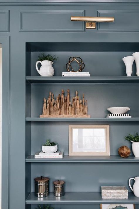 Blue Library, Blue Bookshelves, Den Library, Light Grey Kitchen Cabinets, Blue Bookcase, Brass Picture Light, Light Grey Kitchens, Blue Shelves, Light Gray Cabinets