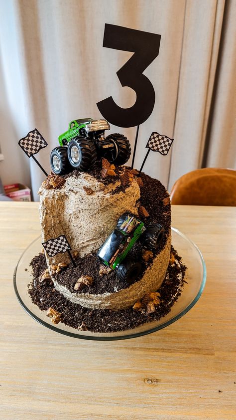 Peanut butter oreo cake, decorated to have a ramp and monster trucks! Monster Truck Cake 4, 3 Monster Truck Cake, Mini Monster Truck Cake, Small Monster Truck Cake, Two Tier Monster Truck Cake, Monster Truck Birthday Cake, Cake Leveler, Truck Birthday Cakes, Monster Truck Cake