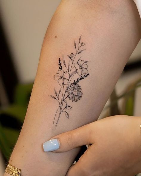 Flower Tattoos Feminine, Small Hip Bone Tattoos Women, Heartbeat Flower Tattoo, Wrist Birth Flower Tattoo, June Flower Bouquet Tattoo, Fine Line Wildflower Bouquet Tattoo, Tattoo Ideas With Meaning Inspiration, Tricep Flower Tattoo Women, Flower Bunch Tattoo Design