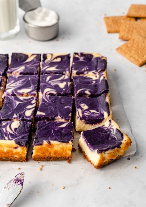 These easy Ube Cheesecake Bars are made with a buttery graham cracker crust, tangy NY-style cheesecake filling, and ube swirl. It's the perfect dessert for parties, holidays, and gatherings. Ube Cheesecake Bars, Ube Cheesecake, Ube Jam, Ny Style, Cheesecake Filling, Cracker Crust, Creamy Cheesecake, Cheese Serving, Cheesecake Bars