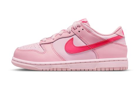 Nike’s Dunk Low is no exception to the trend of pastel-colored sneakers as Easter approaches. When it first debuted earlier this year, the Nike Dunk Low “Triple Pink” was a refreshing change of pace. Nike’s simple color scheme complements Peter Moore’s iconic design, which features a variety of pink shades, most of which are pastels. Hyper pink dominates the Swooshes and brand marks, with lighter shades appearing on the overlays, liners, upper, and sole unit as you move lower i Nike Dunk Low Triple Pink, Nike Rosa, Dunks Nike, Different Shades Of Pink, Pink Nikes, Pink Sneakers, Swag Shoes, Nike Kids, Nike Dunk Low