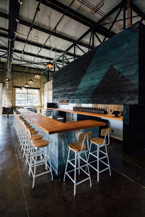 An indoor biergarten with an industrial edge, this is the perfect combination of the traditional beer hall and the modern meeting place. Taproom Design, Taproom Ideas, Warehouse Bar, Brewery Interior, Brewery Decor, Brewery Taproom, Brewery Ideas, Brewery Bar, Tap House